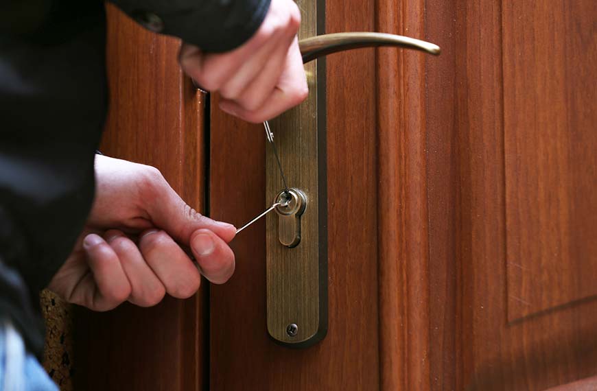 Lockpicker breaking into a door needing theft insurance claims adjuster in Coral Gables, FL